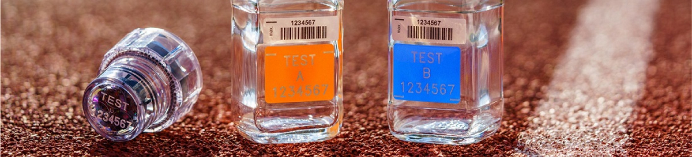 Empty testing bottles on an athletics track.