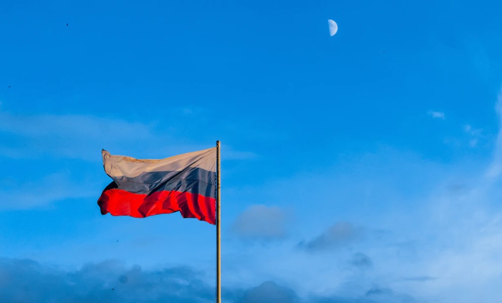Russian flag against a blue sky