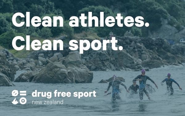 Triathletes run out of the ocean